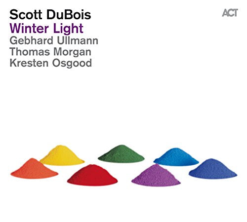 Album cover with text and seven small mounds of colorful powder on white background.