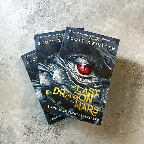 Two copies of The Last Dragon on Mars book featuring a dragon eye cover.