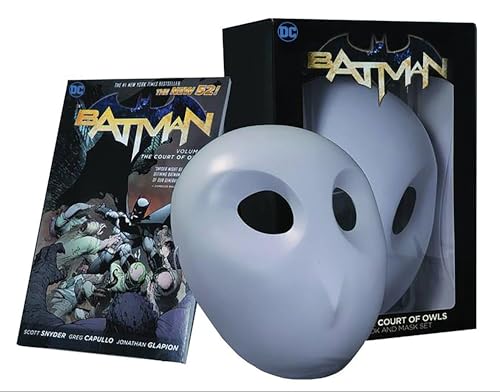 Batman graphic novel and white owl mask set in a black box.