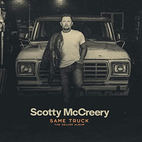 Scotty McCreery poses with a vintage truck on album cover.