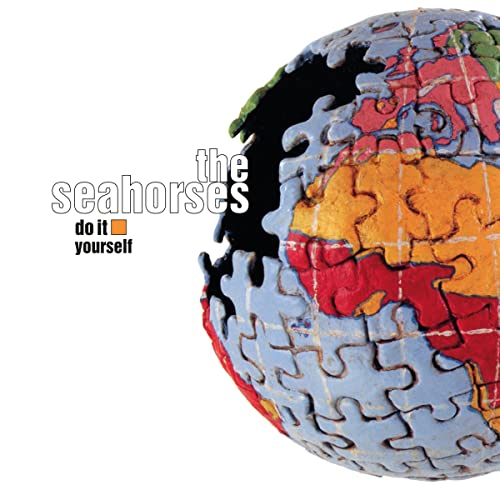 Album cover for “The Seahorses” featuring a colorful jigsaw globe.