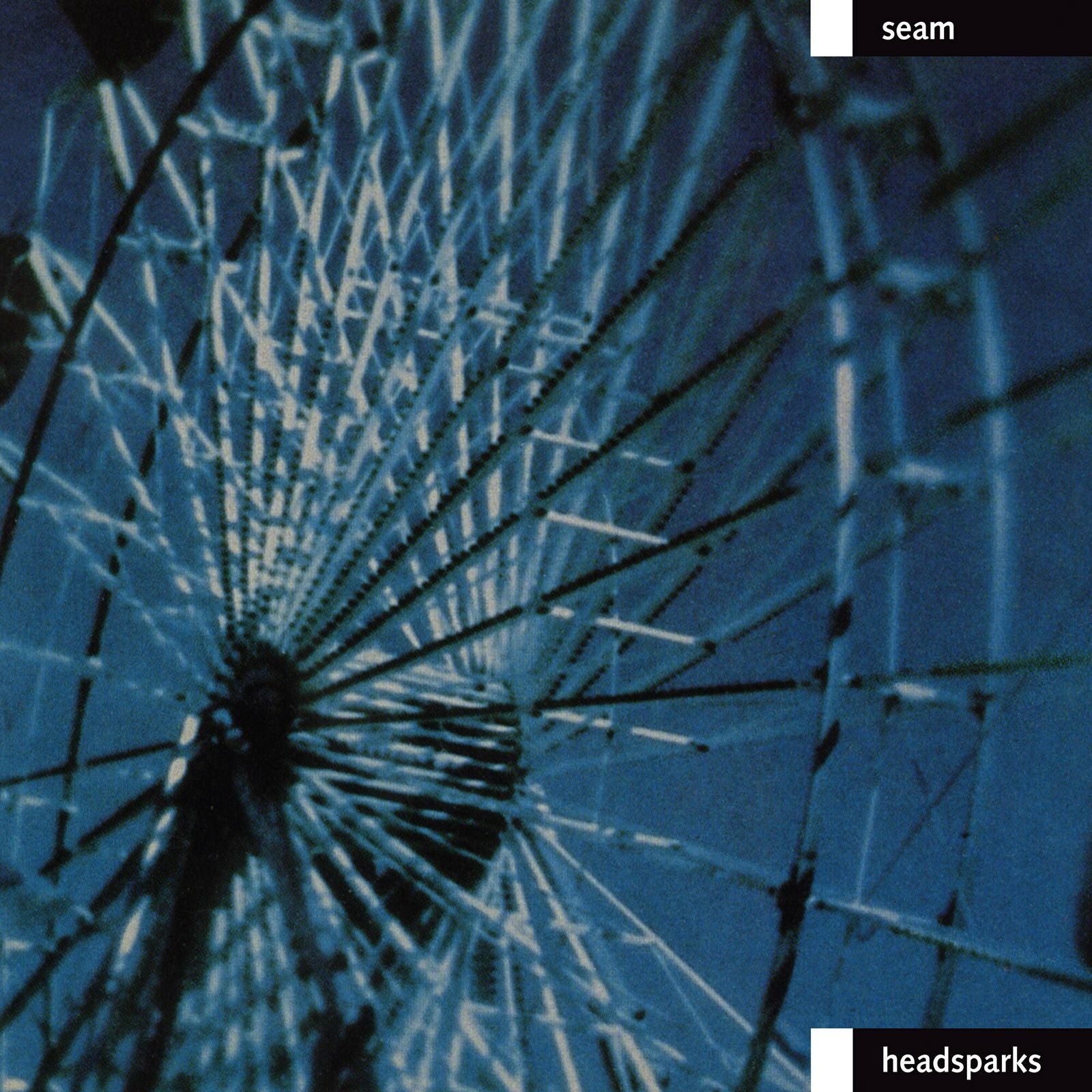 CD cover for Seam’s “Headsparks” featuring a fractured, radial blue image.