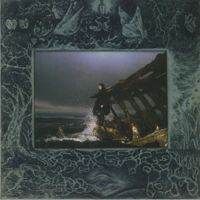 Dark album cover with a framed image of a person by a shipwreck.