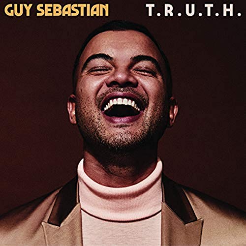 Album cover for Guy Sebastian’s “T.R.U.T.H.” featuring a smiling man.