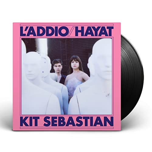 Vinyl record cover with a couple and white bust sculptures.