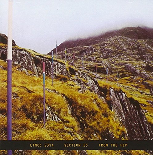 "CD cover featuring a rocky hillside with colorful poles and foggy mountains."