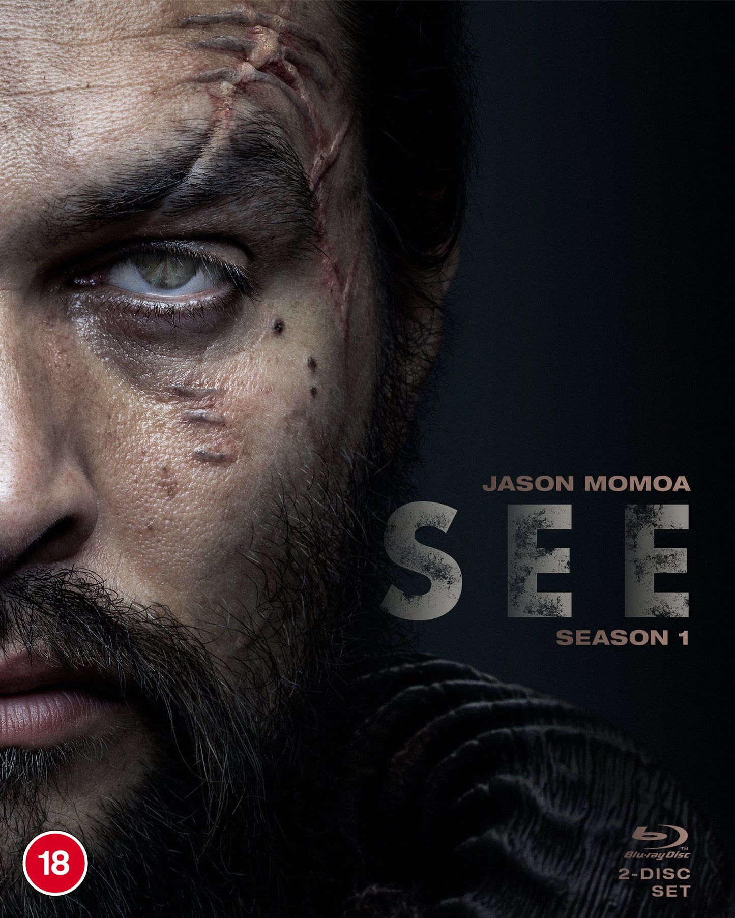 Blu-ray cover for "See" Season 1, featuring Jason Momoa’s scarred face.