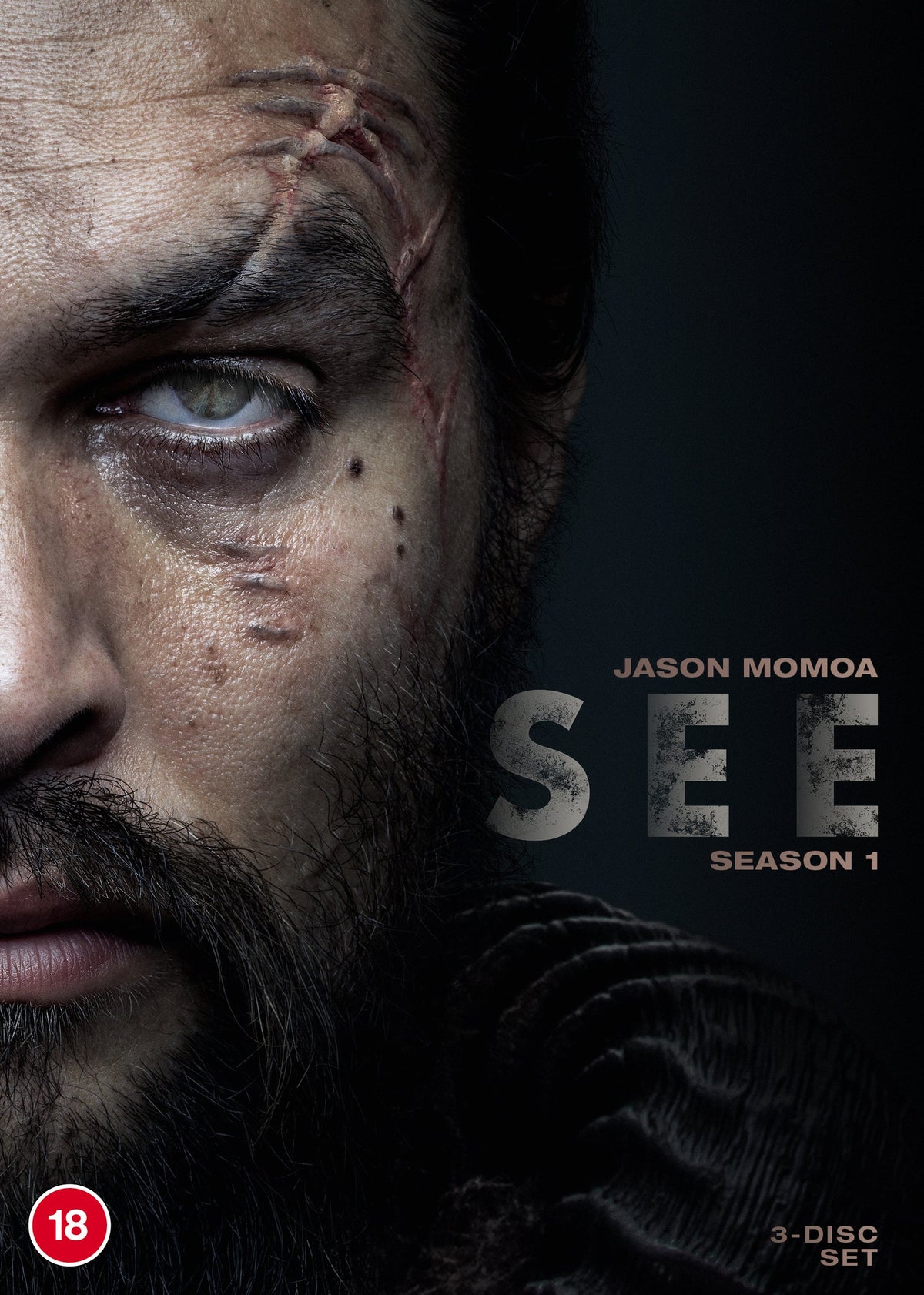 DVD cover for "See" Season 1 featuring Jason Momoa’s scarred face.