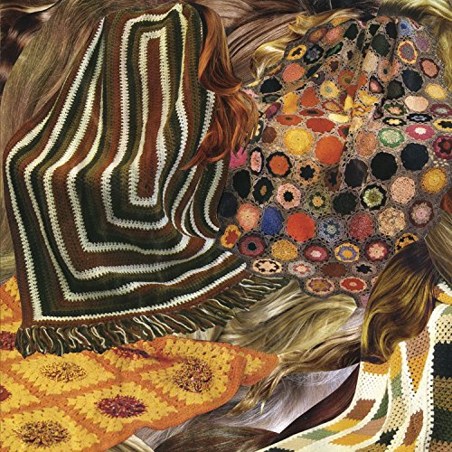 Album cover for Ty Segall’s “Sleeper” featuring people wrapped in crocheted blankets.