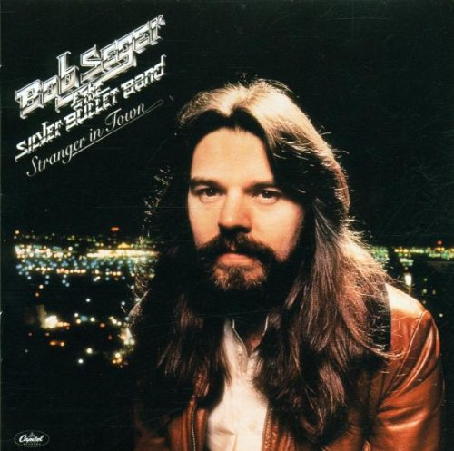 Bob Seger album cover: portrait of a man with city lights.