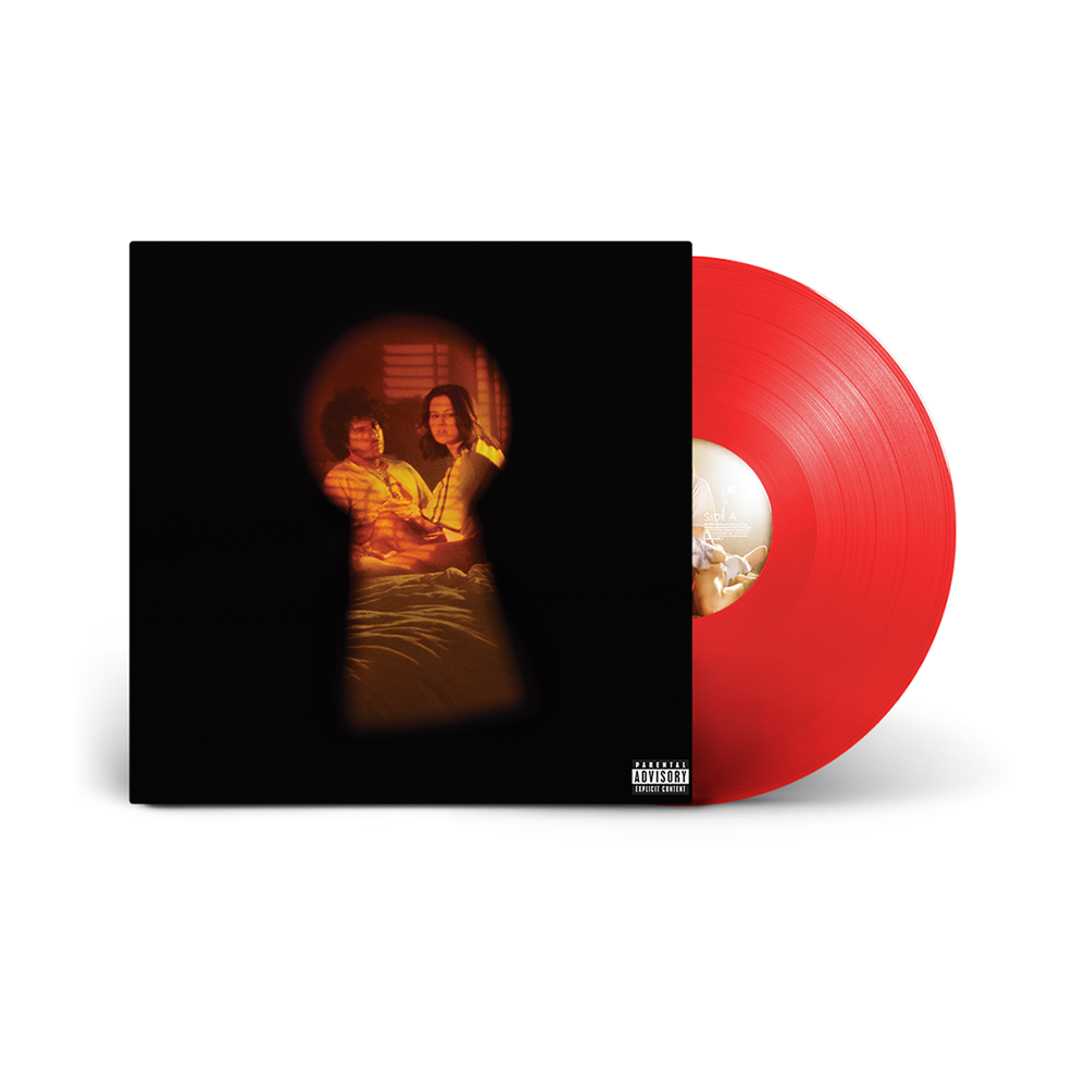 Vinyl record with red disc and album cover featuring two people.