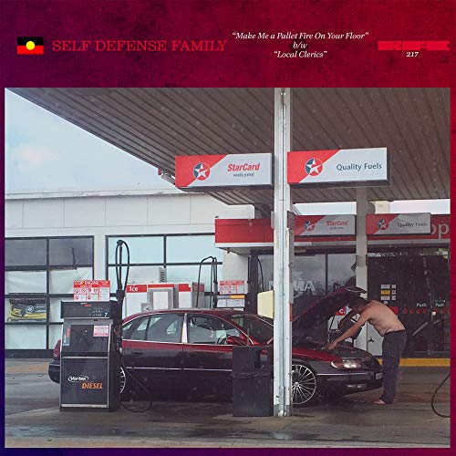 Vinyl album cover depicting a man working on a car at a gas station.