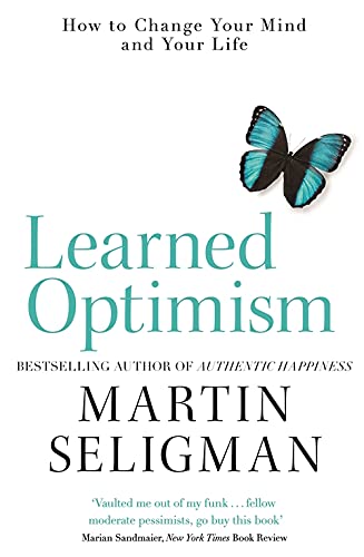 Book cover for Learned Optimism by Martin Seligman featuring a blue butterfly.
