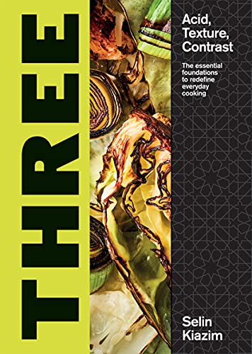 Cookbook cover with bold title “THREE” and close-up food photography.