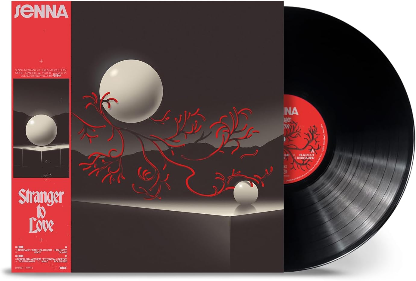 Vinyl record and album cover featuring white spheres and red branches on dark background.