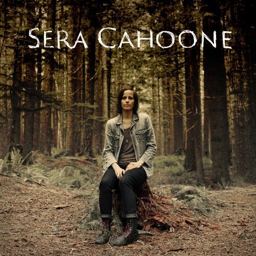 Sera Cahoone album cover: woman sitting on a tree stump in a forest.