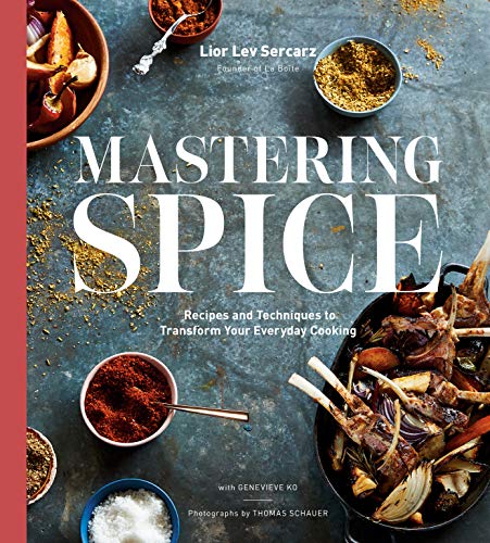 Cookbook cover with spices, roasted meat, and the title "Mastering Spice.