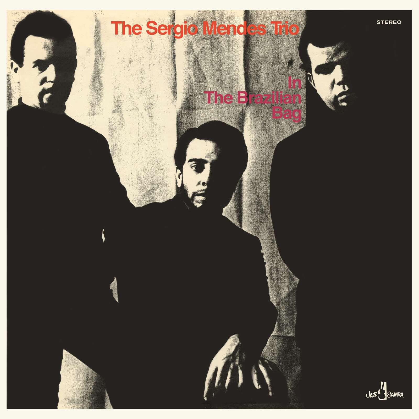 Album cover featuring three men in dark clothing against a textured beige background.