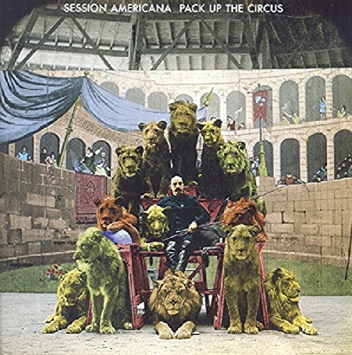 Vintage circus poster with a trainer and several large lions.