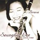 Seunghee Lee smiling, holding a clarinet, album cover for “Brava.”