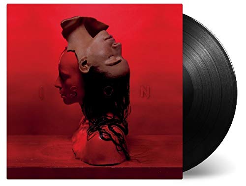 Red album cover with fragmented faces and a black vinyl record.