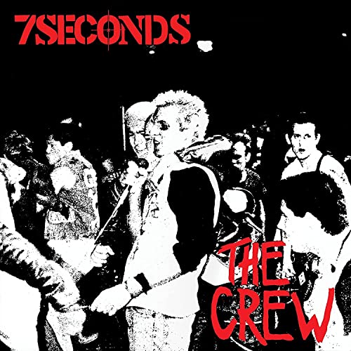 Black and white photo of a punk band performing with red text overlays.