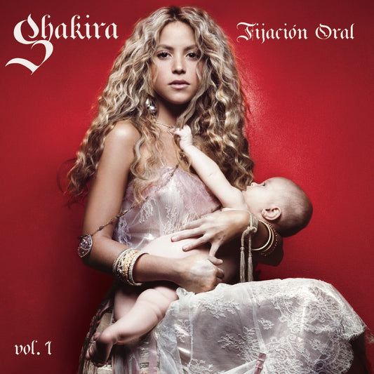 Shakira holding a baby on a red background, album cover art.