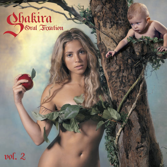 Shakira album cover featuring a woman and baby amongst tree branches.
