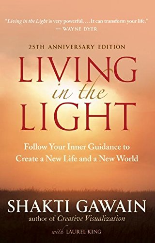 Book cover with red title “Living in the Light” over a sunrise.