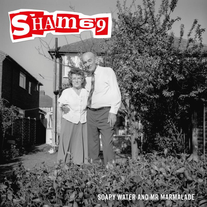 Black and white album cover featuring an elderly couple in a garden.