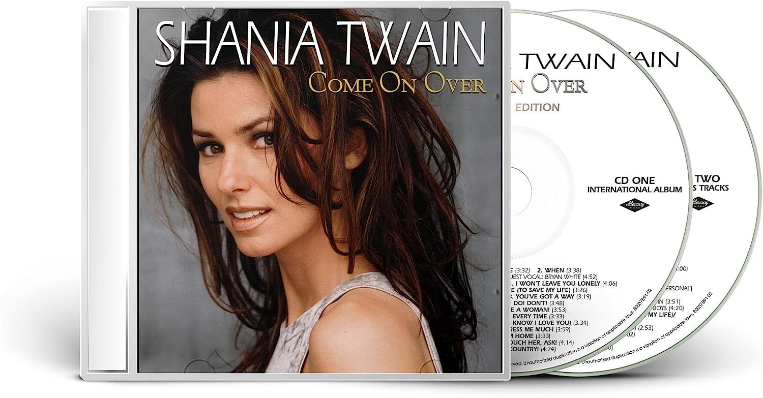 "CD case with Shania Twain's image and two discs inside."