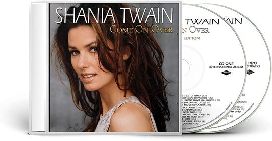 "CD case with Shania Twain's image and two discs inside."