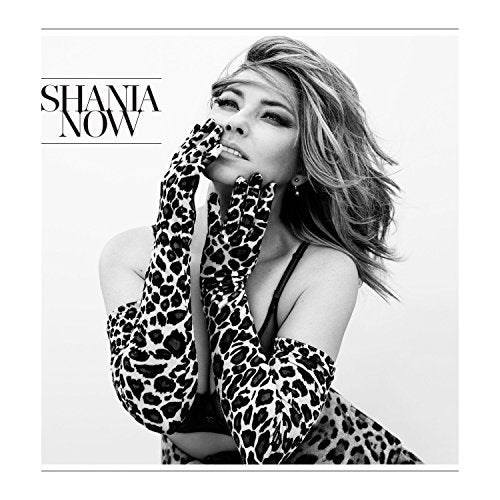 Black and white album cover of Shania Twain in leopard print gloves.