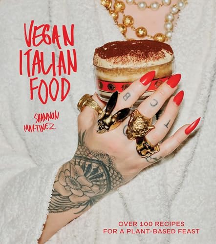 Cookbook cover with red nails holding a tiramisu dessert.
