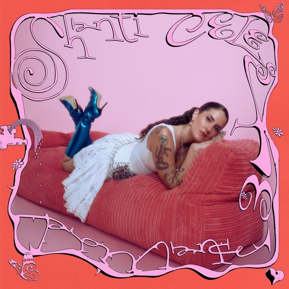 Album cover for Shanti Celeste’s “Romance” featuring a woman reclining on red.