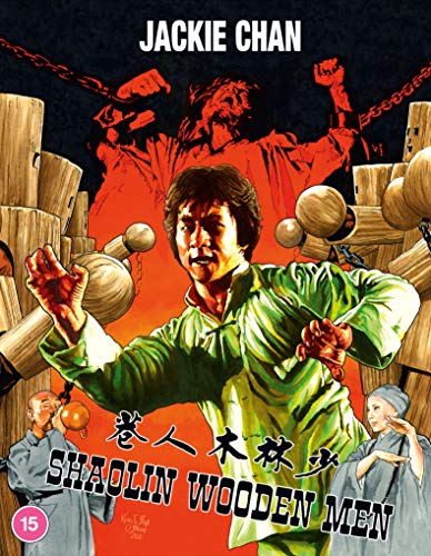 Jackie Chan in a martial arts pose surrounded by wooden training dummies on Blu-ray.