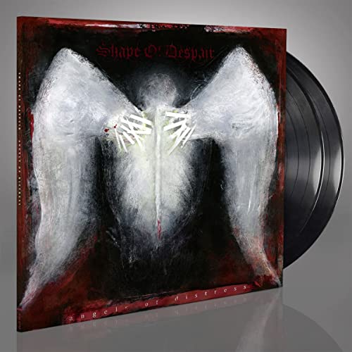 Vinyl record with album cover depicting a dark, winged figure.