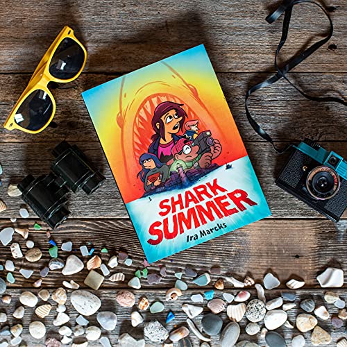 Book cover for “Shark Summer” with children and a shark, surrounded by beach items.