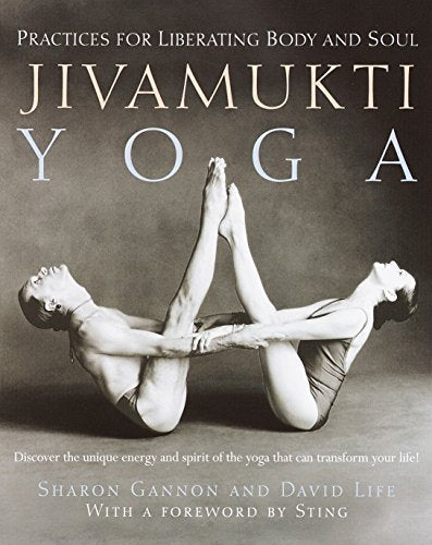 Book cover showing two people performing a partner yoga pose against a grey background.