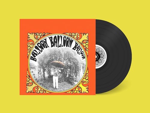 Vinyl record with orange cover featuring a black and white photo.