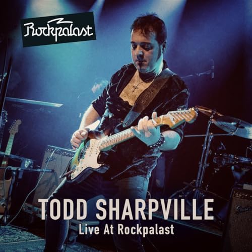 Todd Sharpville playing a blue electric guitar on stage at Rockpalast.