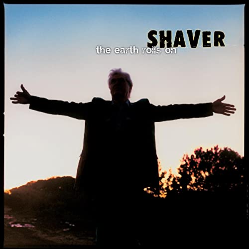 Album cover for Shaver’s “The Earth Rolls On” featuring a silhouetted man.