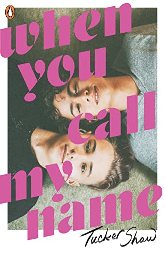 Book cover showing two young men lying side-by-side with large pink text overlaid.
