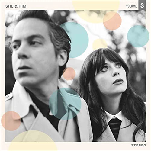 Black and white portrait of She and Him with overlaid colorful translucent circles.