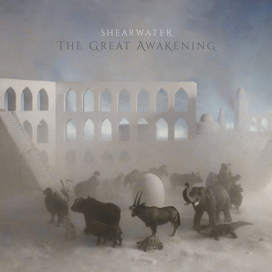 CD cover: animals and architecture in a misty, dreamlike landscape.