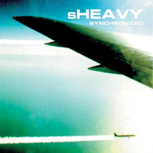 Sheavy “Synchronized” vinyl album cover with a dark airplane silhouette.