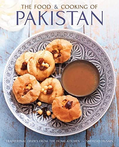 Cookbook cover featuring fried pastries and sauce on a patterned plate.