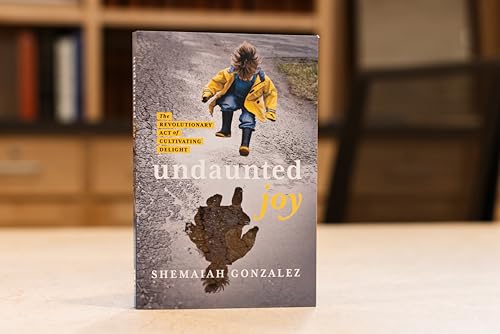 Book cover with a child in a yellow raincoat running on pavement.