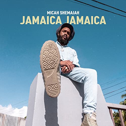 Album cover for Micah Shemaiah’s “Jamaica Jamaica” featuring a seated man.