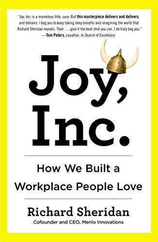 Book cover: "Joy, Inc." with a Viking helmet on the "J".